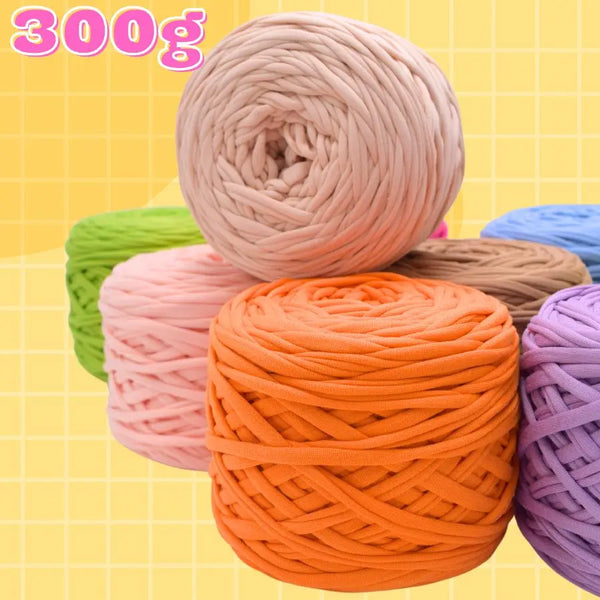 A collection of various colored craft yarn spools, including pink, orange, green, and purple, displayed against a yellow back