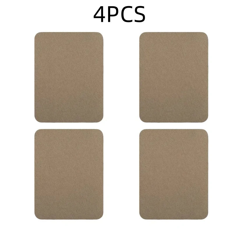 A set of four tan iron-on fabric repair patches.