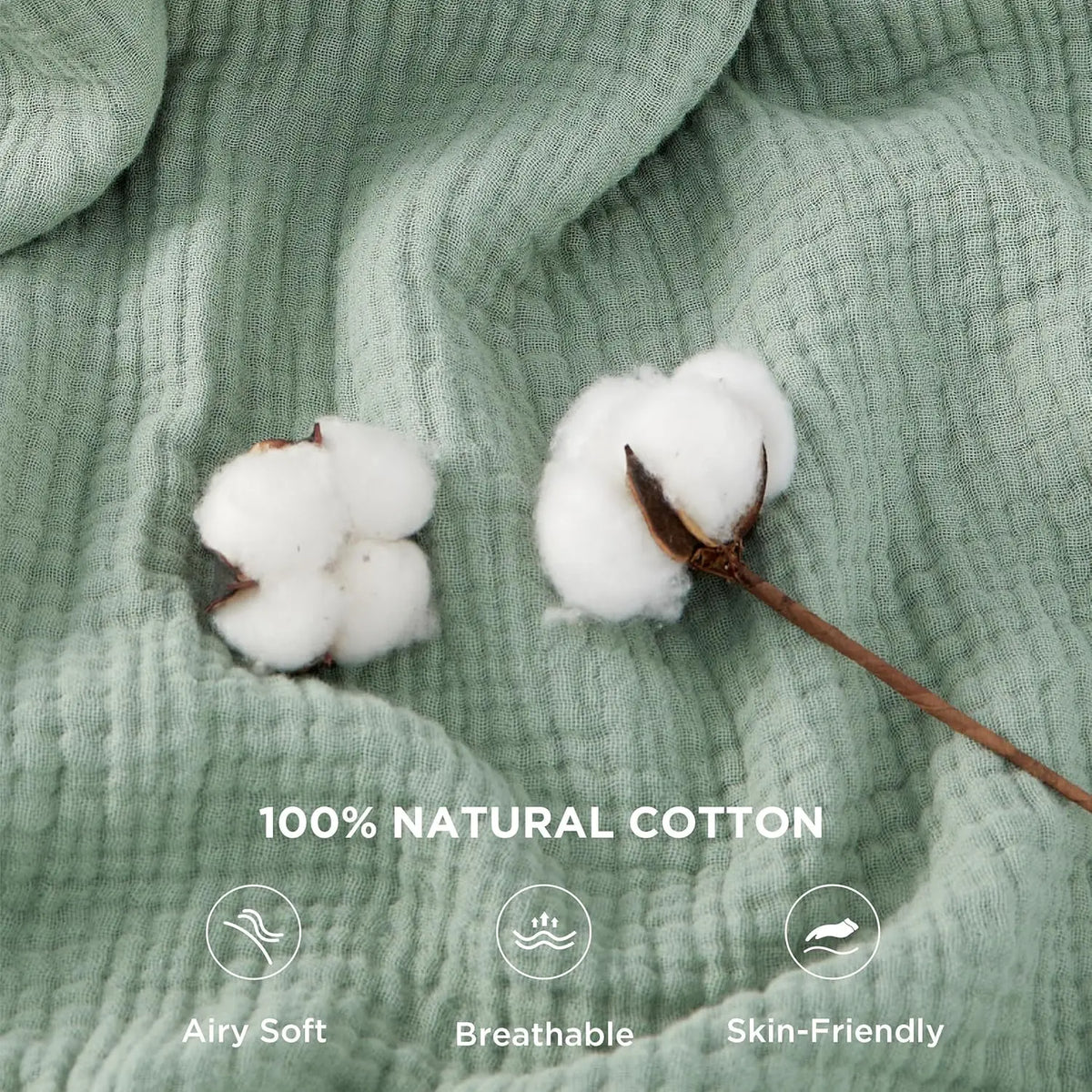 A close-up of a light green muslin blanket with white cotton balls and text describing its features.