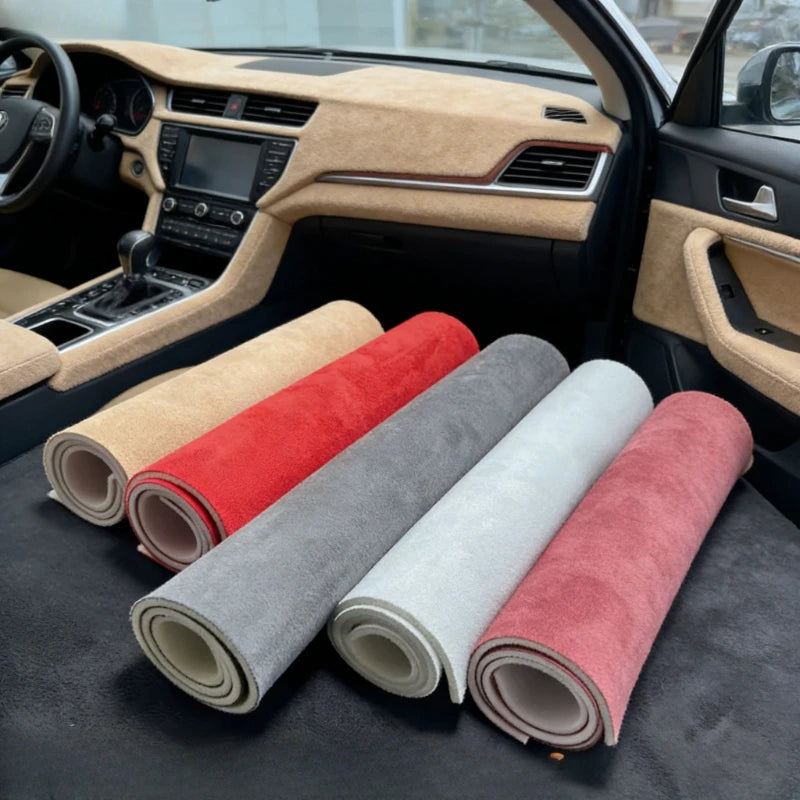 Rolls of premium suede auto headliner fabric with foam backing in various colors like red, gray, and beige.