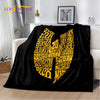 A black flannel throw blanket featuring a large yellow graphic text design on a white background.