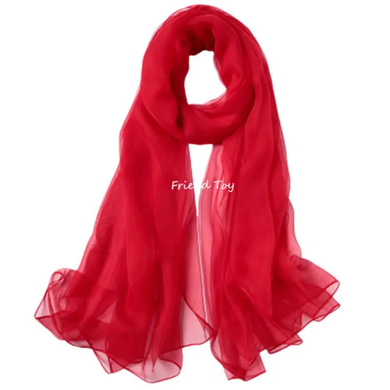 A vibrant red sheer scarf draped elegantly.