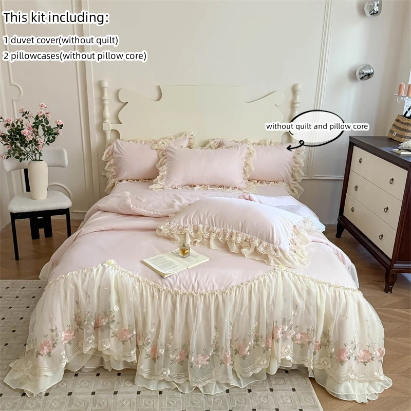 A pink and white Korean style lace embroidered duvet set featuring a duvet cover, pillowcases, and a lace-trimmed bed skirt.