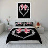 Black bedding set featuring a diamond heart print with a pink bow design and a silver diamond border.