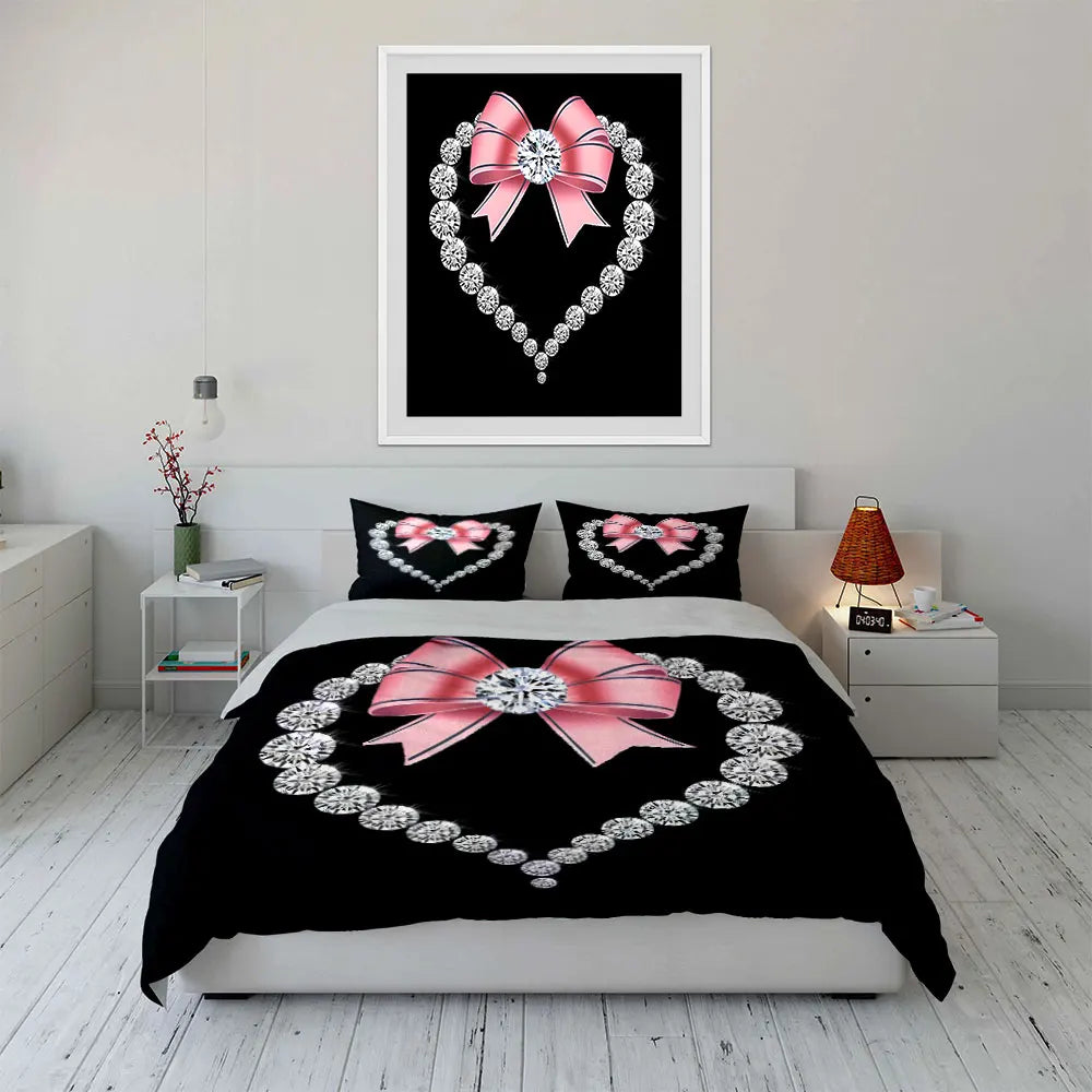 Black bedding set featuring a diamond heart print with a pink bow design and a silver diamond border.