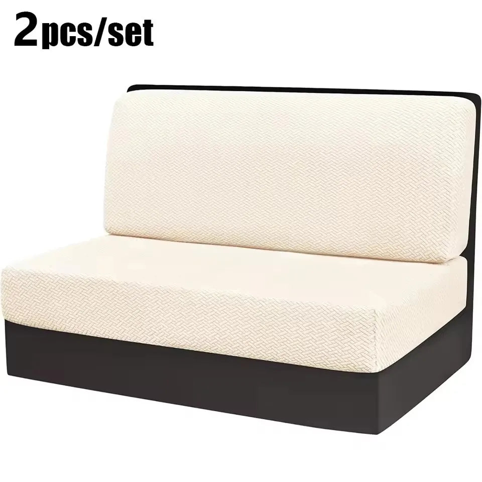 A pair of beige stretch jacquard seat covers for vehicle upholstery shown on a black base.