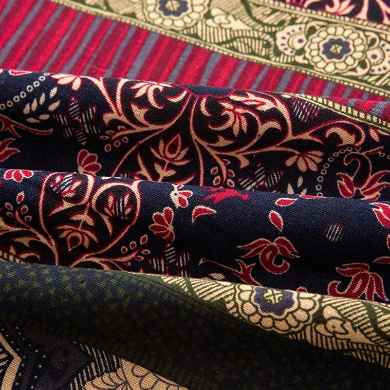 Close-up of folded bohemian printed linen fabric in various colors and patterns.