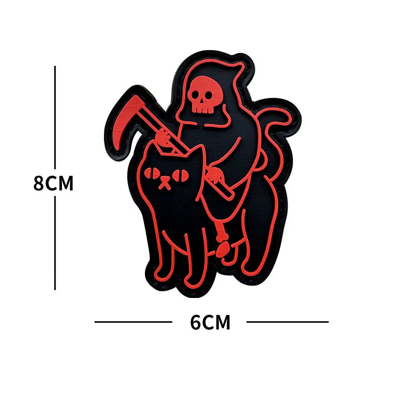 Black glow-in-the-dark sticker featuring a skull and a cat with a pickaxe.