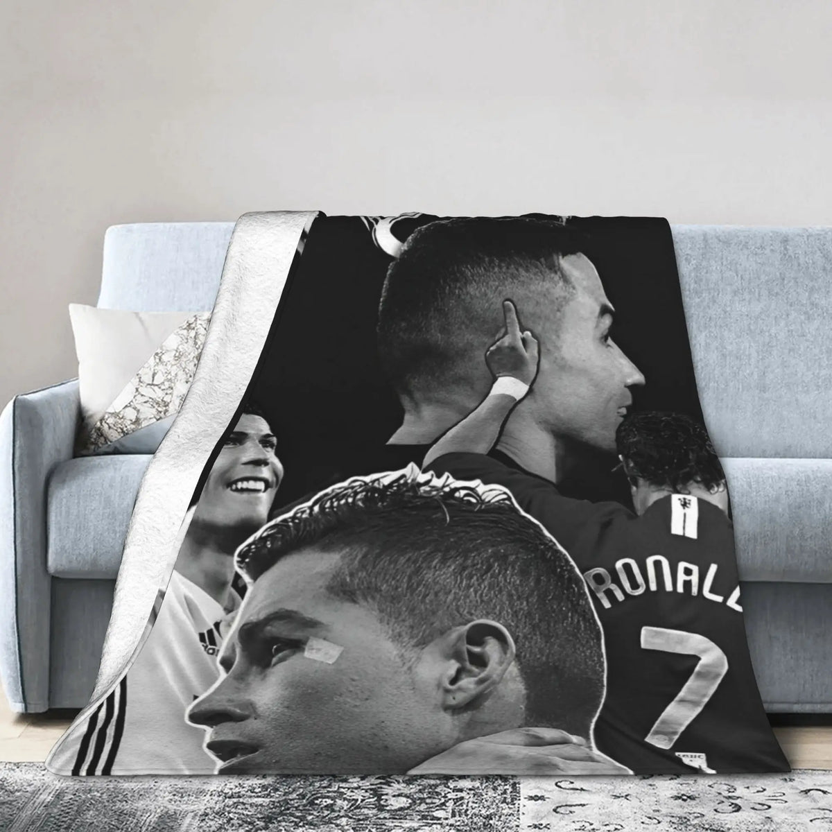 A black and white photo of a soccer player's profile, used as a design for a wool throw blanket.