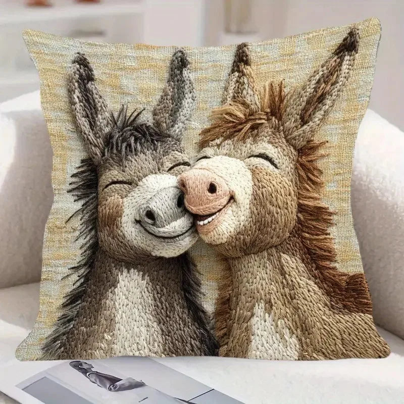A realistic knitted illustration of two donkeys with affectionate expressions on a pillow cover.