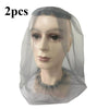 Two sheer grey mosquito nets with face masks displayed on a mannequin head.