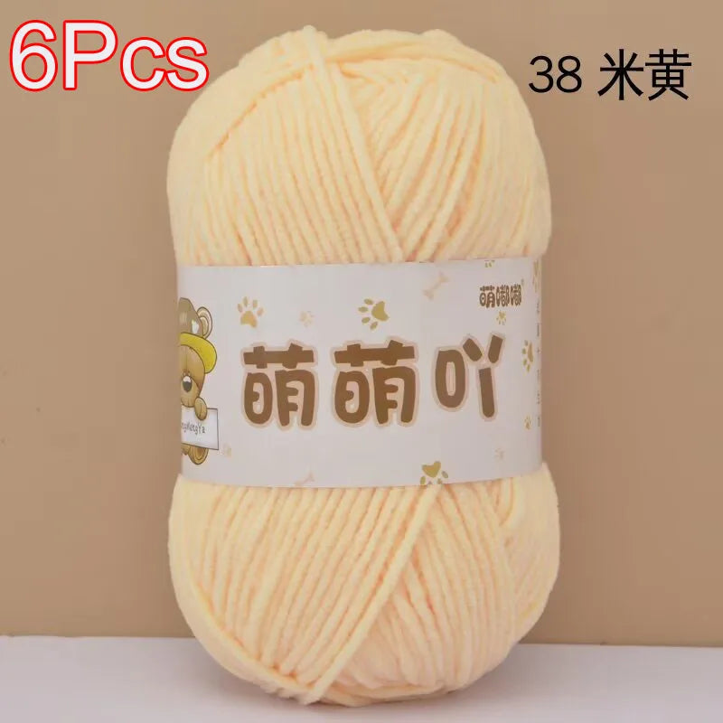 A ball of light yellow chenille yarn labeled as 38 strands for crochet and knitting.