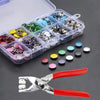 A clear plastic box filled with various metal prong snap button fasteners and a pair of silver and red pliers.