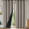 Floor-length gray blackout window curtains hanging on a rod in a bright room.
