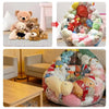 A large, colorful inflatable storage bag filled with various plush toys and stuffed animals.