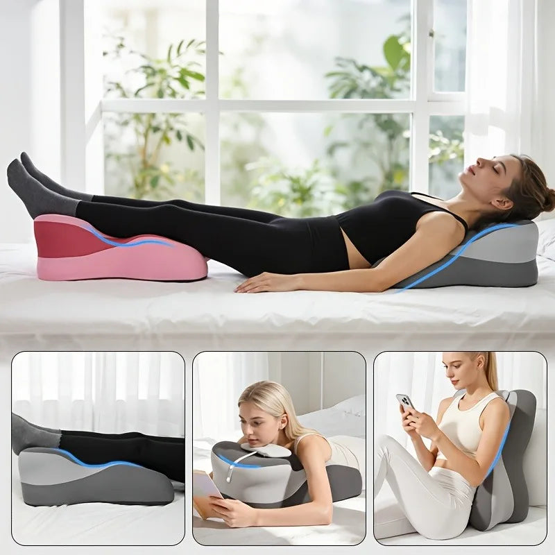 A woman is lying on a bed using a pink and gray ergonomic pillow for neck and back support.
