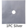 A single piece of silver metal with a circular hole and radiating arms, used as a stove burner protector mat.