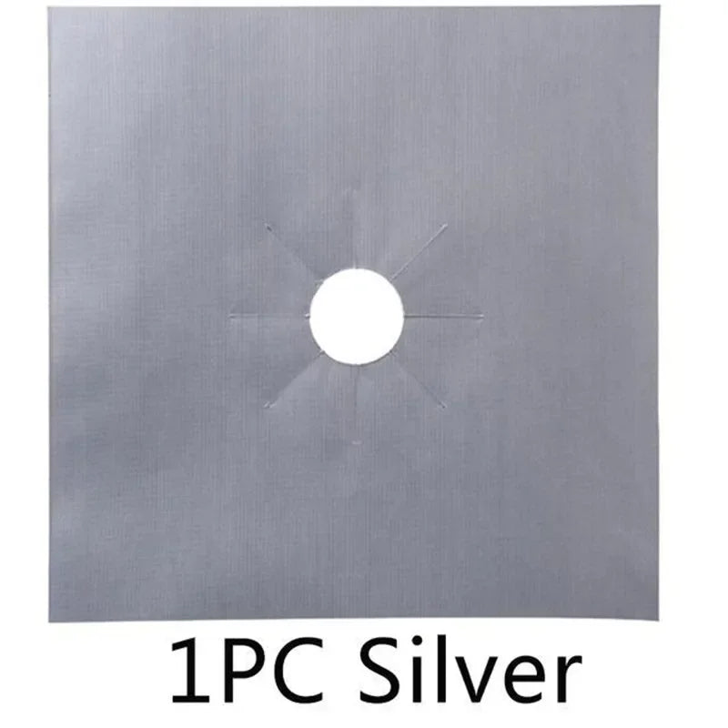 A single piece of silver metal with a circular hole and radiating arms, used as a stove burner protector mat.