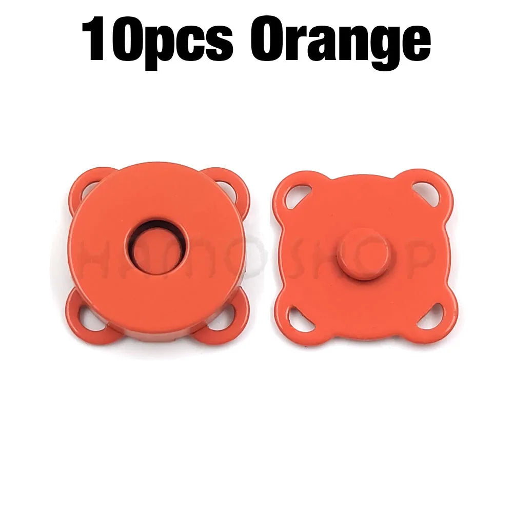 Ten orange metal magnetic snap buttons for sewing