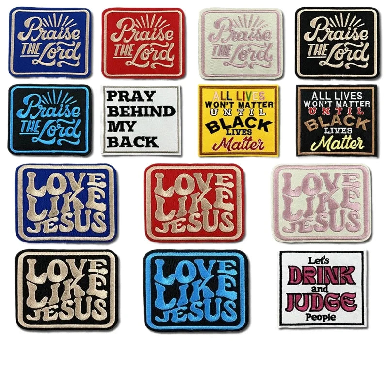 A collection of embroidered iron-on clothing patches featuring biblical phrases like Praise The Lord, Pray Behind My Back, an