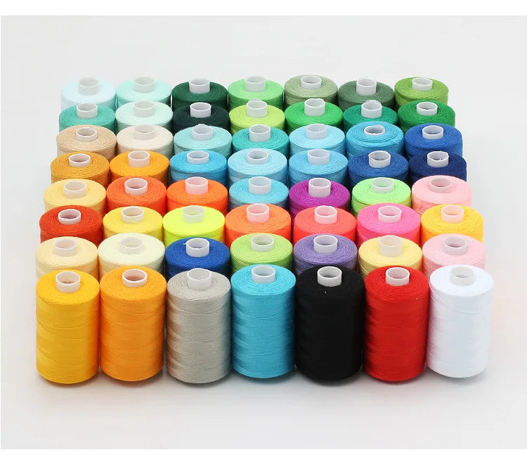 A collection of ten colored polyester sewing thread spools arranged in a row.