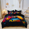A dark blue duvet cover featuring a vibrant yellow and orange gaming controller design with the text PLAYER