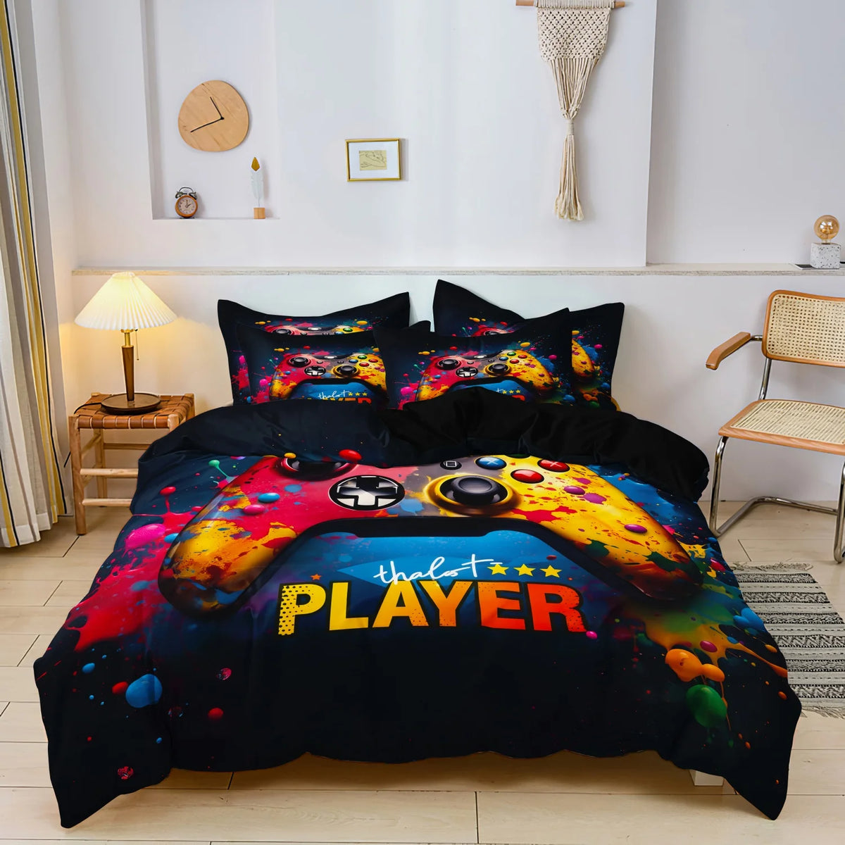 A dark blue duvet cover featuring a vibrant yellow and orange gaming controller design with the text PLAYER