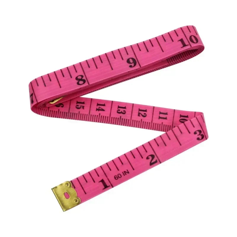 Pink fiberglass body measuring tape showing markings up to 10 inches and 60 inches