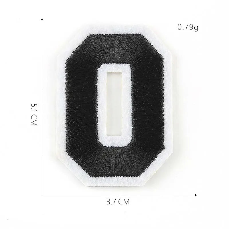 A black felt number zero patch with a white border and a rectangular cutout, measuring 3.7 cm by 5.1 cm.