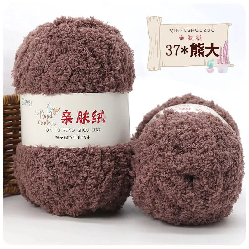 A set of soft coral velvet yarn balls for crafting, displayed next to packaging and a plant illustration.