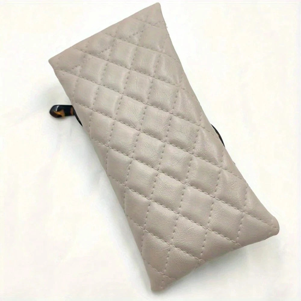 A light beige quilted PU leather eyeglass case with a black cleaning cloth visible on the side.