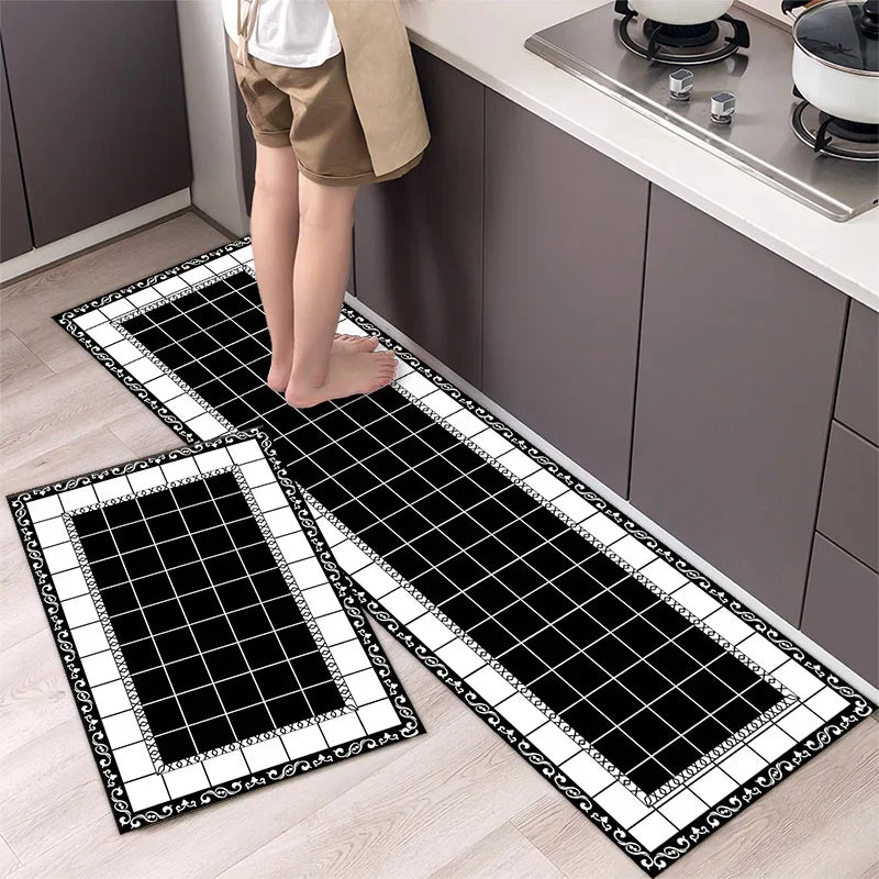 Two black and white diamond print non-slip kitchen rugs displayed on a light wood floor.