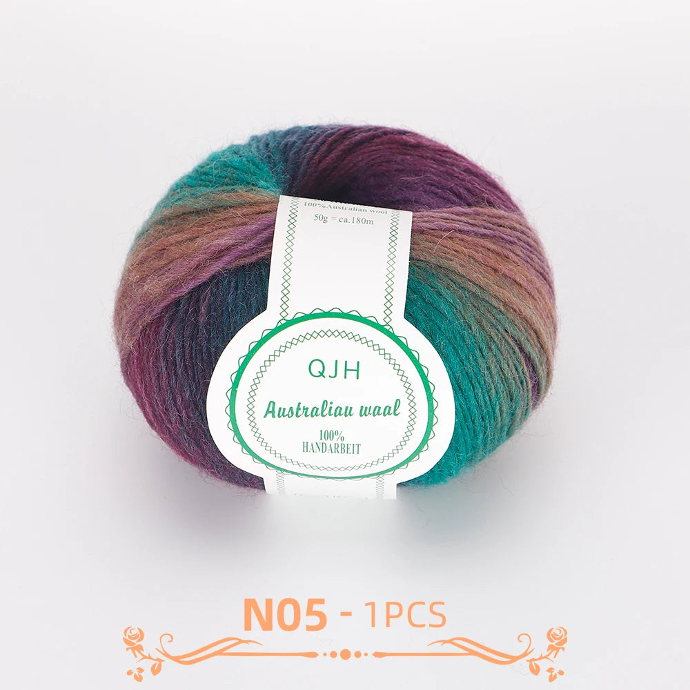 A ball of multi-colored wool yarn featuring shades of teal, green, purple, and brown.