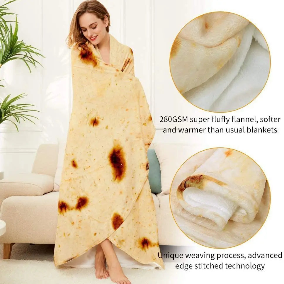A woman wearing a yellow blanket throw sits on a sofa, showcasing the soft texture and unique stitching of the burrito pizza 