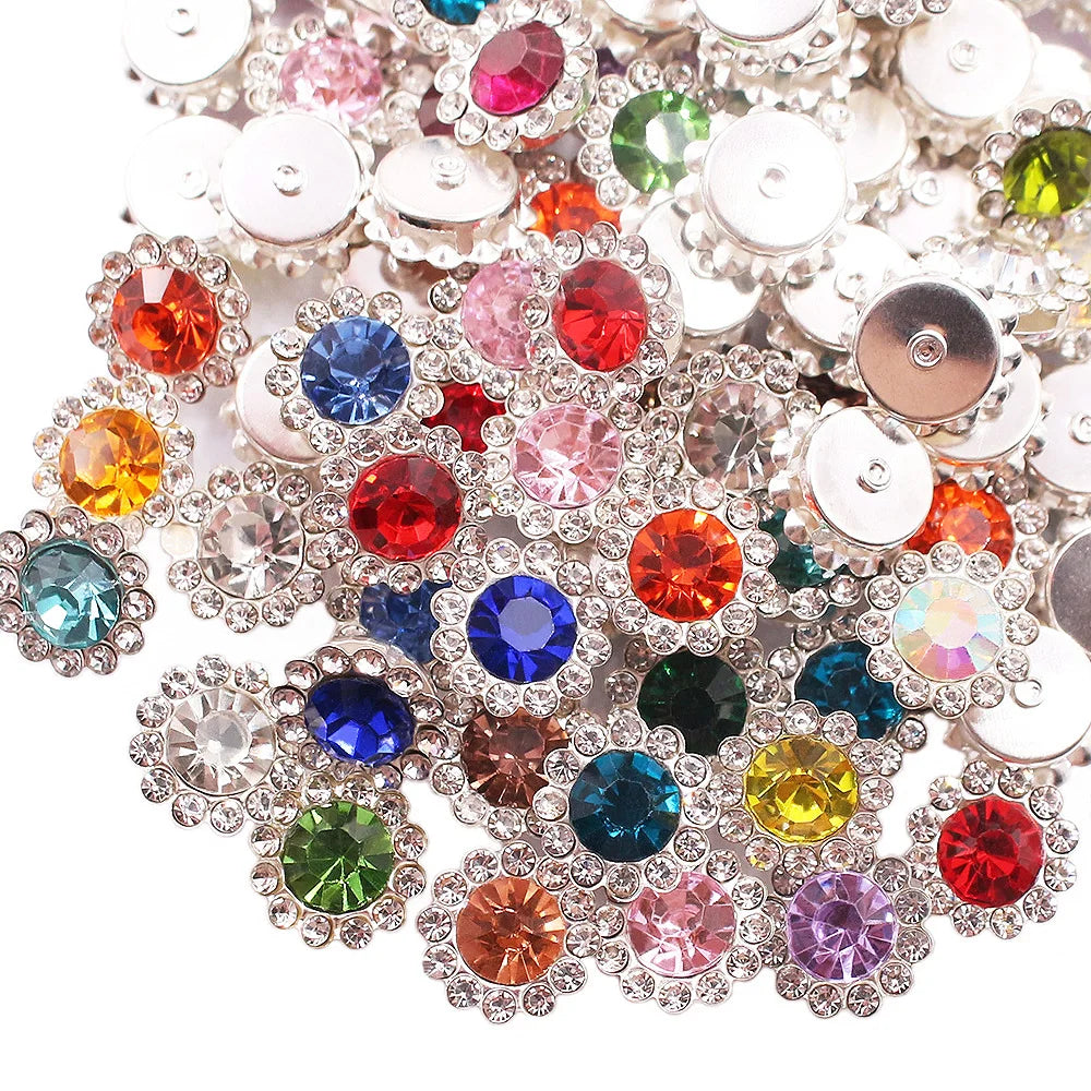 Close-up of sunflower crystal rhinestone sew-on buttons in various colors and sizes.