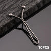 Ten metal lapel clips with spherical heads and thin arms are shown against a dark surface.