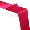 A vibrant magenta satin table runner draped and folded for events.