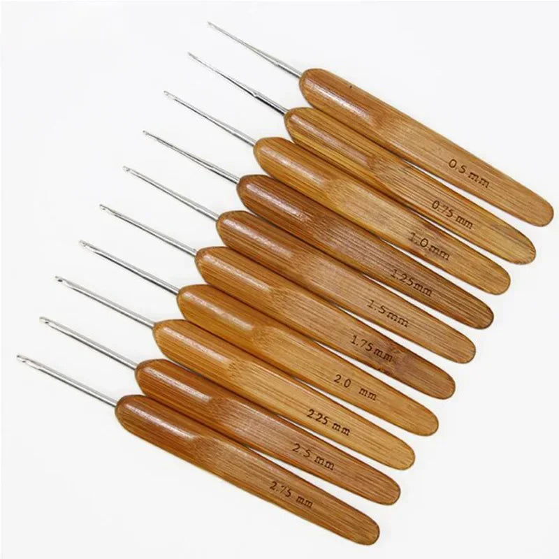 A set of bamboo crochet knitting needles with varying sizes, arranged diagonally.