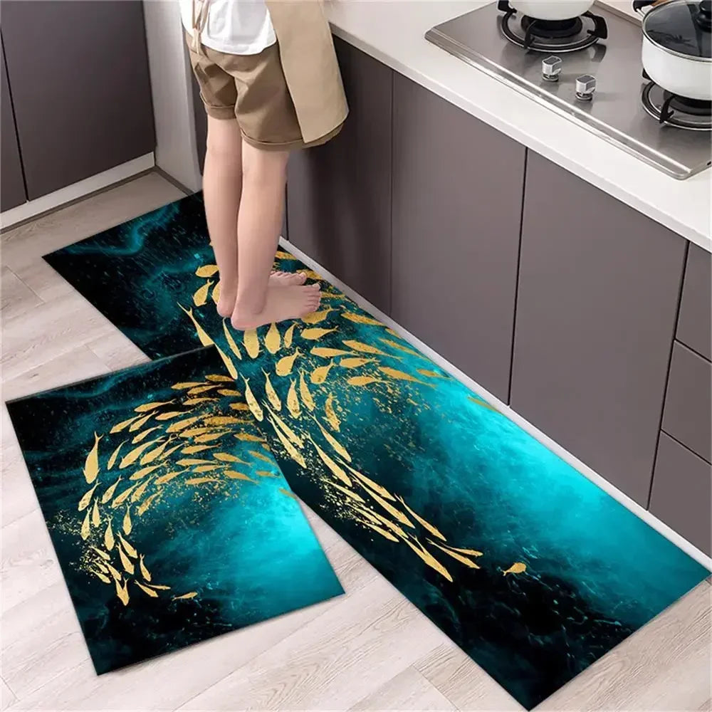 A set of two dark teal and gold diamond print non-slip kitchen rugs placed on a light wood floor.