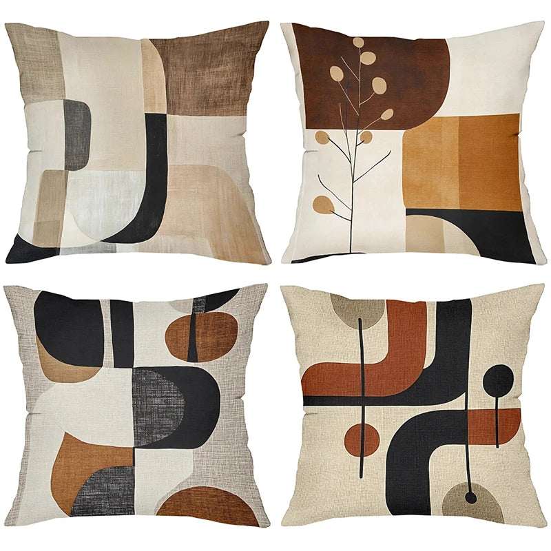 A set of four decorative pillows featuring geometric patterns in earthy tones including brown, beige, black, and olive green.