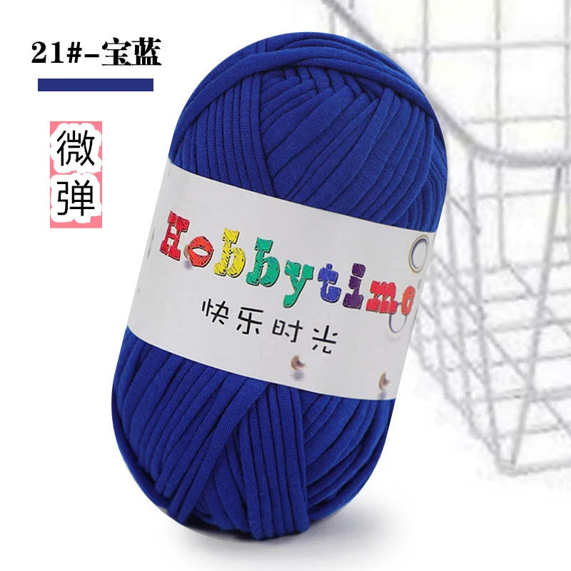 A ball of bright blue thick polyester craft yarn labeled Hobbytime for knitting and crochet