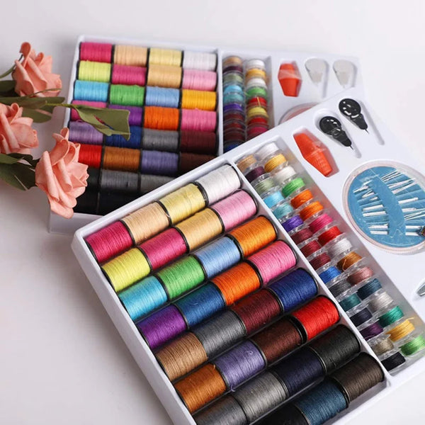 A box of 64-color DIY sewing thread spools arranged in rows and displayed alongside various thread colors.