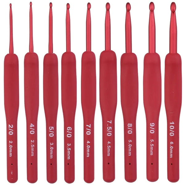A row of red ergonomic crochet hooks with various sizes and tips displayed vertically.