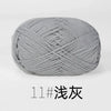 A ball of gray organic cotton 4ply knitting yarn for crafts.