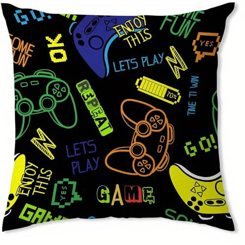 A black decorative pillow cover featuring colorful text and icons related to video games and fun.