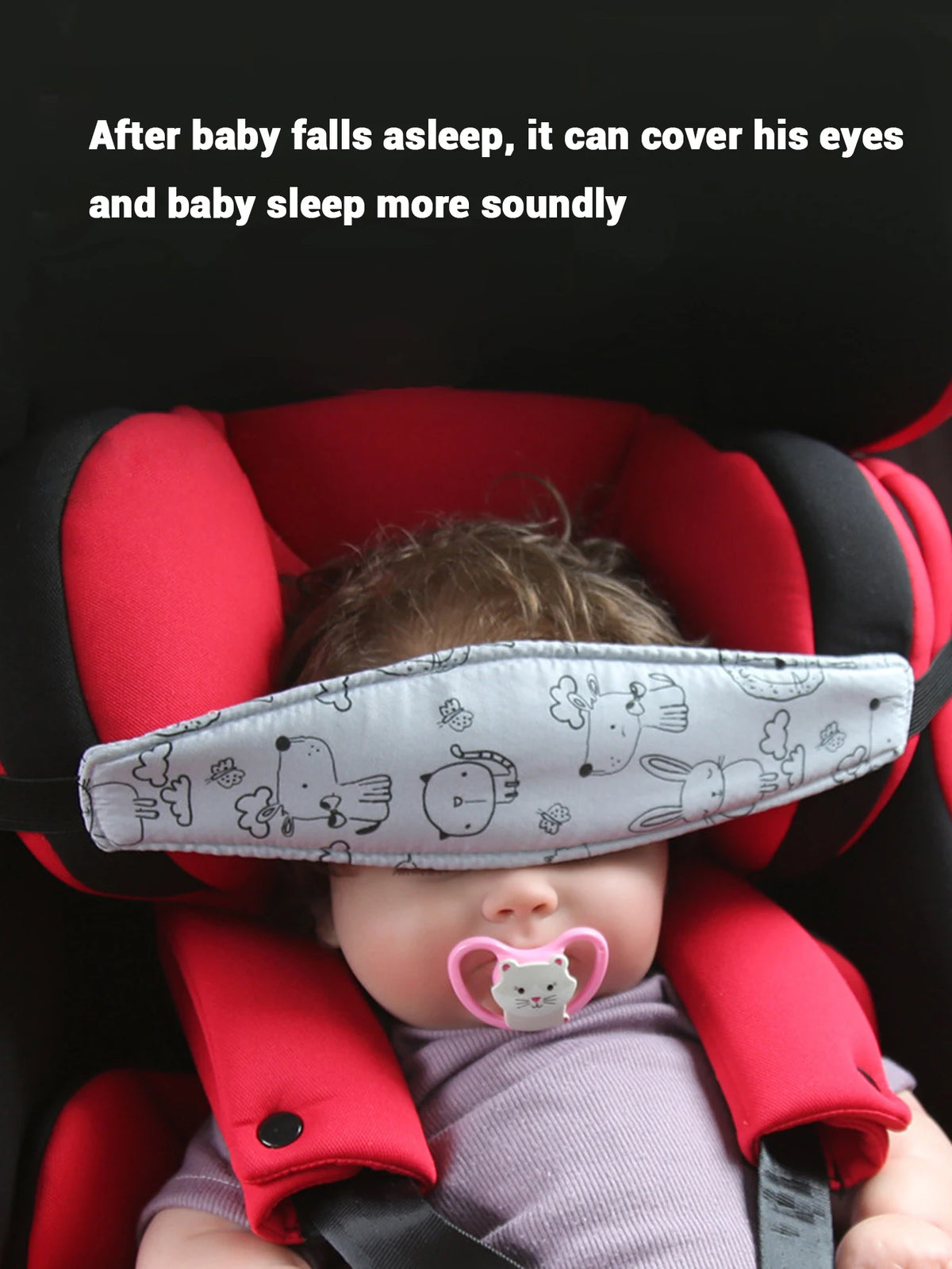 A baby is sleeping in an adjustable car seat with a head support pillow covering his eyes.