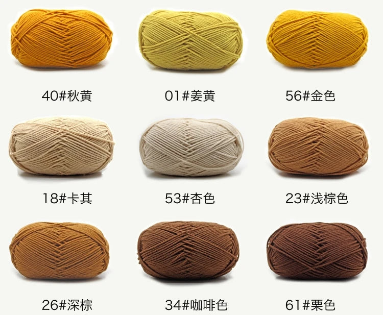 A collection of knitted yarn skeins in various shades of yellow, beige, and brown.