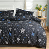 A dark blue and white star pattern duvet cover set with pillows displayed on a bed.