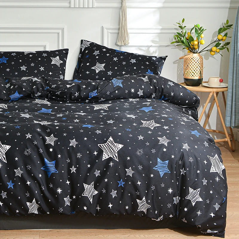 A dark blue and white star pattern duvet cover set with pillows displayed on a bed.