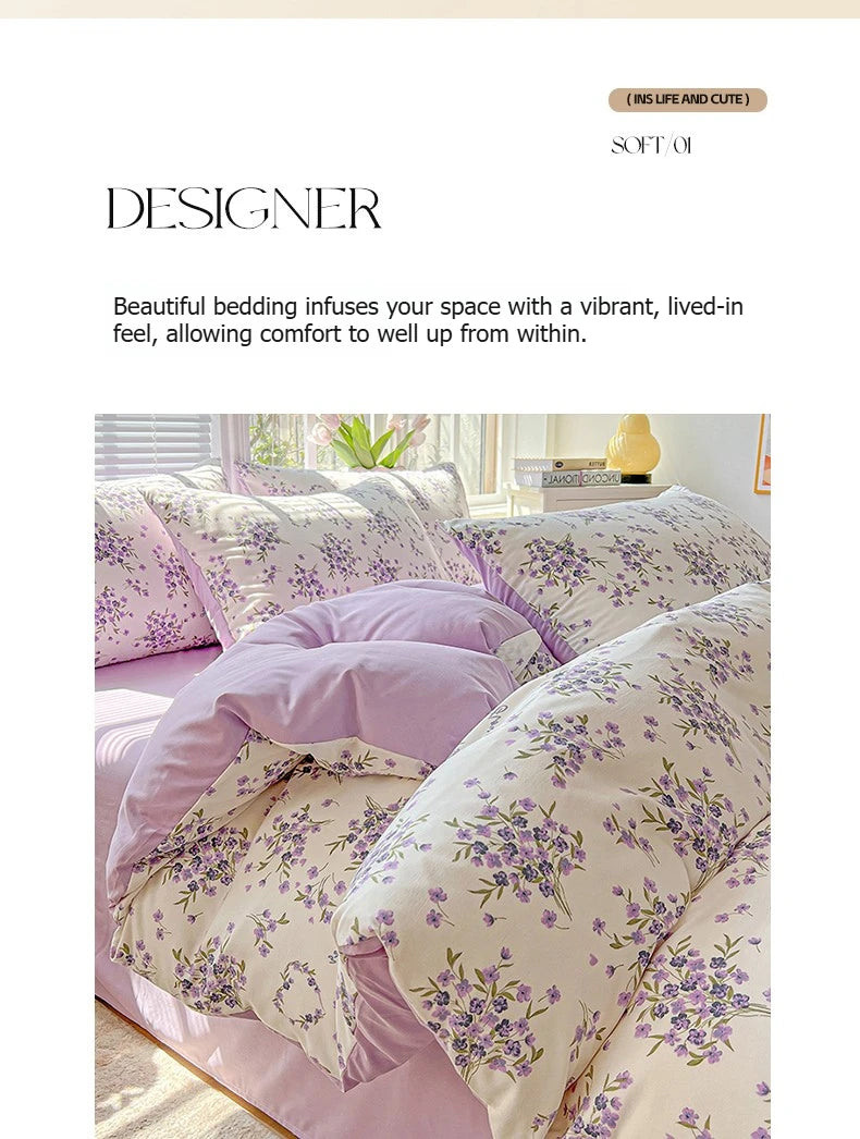 A close-up of floral printed lavender bedding set featuring purple and green botanical patterns.
